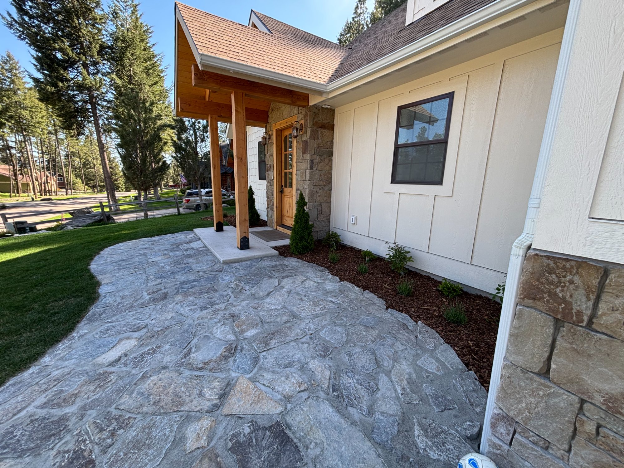 Custom flagstone walkway and hardscape installation in Kalispell Montana